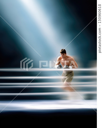 Boxing athlete training dynamically  on a smooth backdrop 130960618