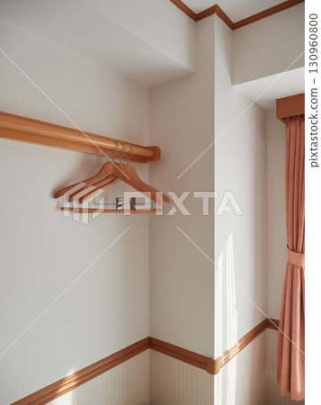 Hotel room wall and hangers 130960800