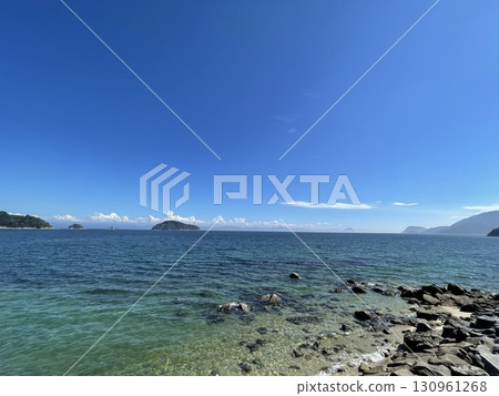 An uninhabited island floating on the calm waters of the Seto Inland Sea in summer An uninhabited island floating on the calm waters of the Seto Inland Sea in summer 130961268
