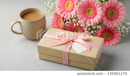 Gift box with flowers and a mug of coffee 130961279