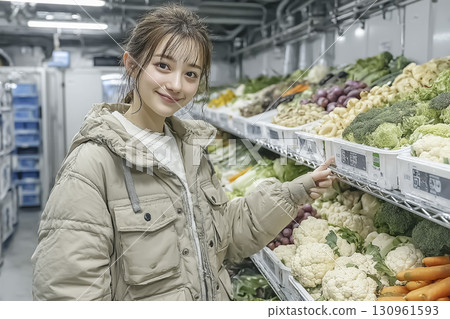 Food is lined up in a large refrigerated case in the center, and Miyu is pointing at it in the front right of the screen. 130961593