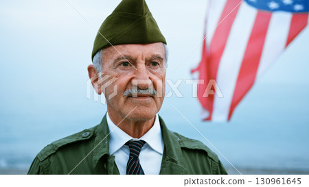 Old Soldier With Moustache With The USA Flag 130961645
