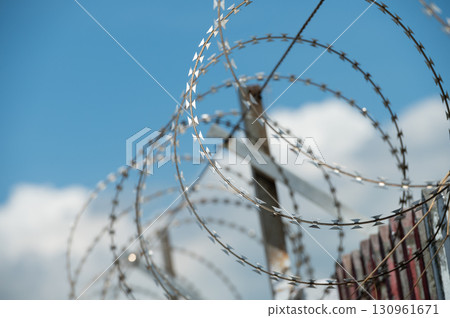 Close shot of razor wire on military fence 130961671
