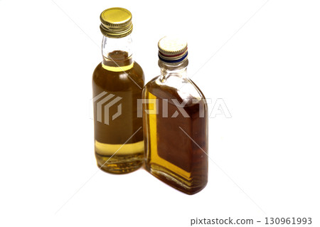 Studio shot of whisky in a carafe and a glass isolated on white 130961993