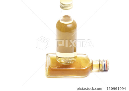 Studio shot of whisky in a carafe and a glass isolated on white Studio shot of whisky in a carafe and a glass isolated on white 130961994
