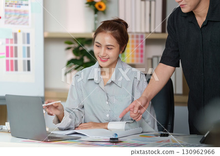 Interior Design Consultation. Professionals discussing color palettes and home aesthetics. Interior Design Consultation. Professionals discussing color palettes and home aesthetics. 130962966