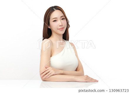 A beautiful young Asian woman with clean, fresh skin against a white background. Skincare, facial treatment, cosmetology, beauty, and spa. An elegant portrait of an Asian woman. A beautiful young Asian woman with clean, fresh skin against a white background. Skincare, facial treatment, cosmetology, beauty, and spa. An elegant portrait of an Asian woman. 130963723