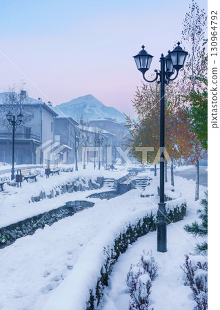 Bansko, Bulgaria street view and Pirin mountains Bansko, Bulgaria street view and Pirin mountains 130964792