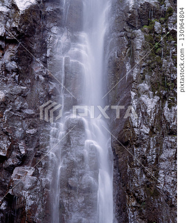 Waterfall water cascading down rocks 130964804