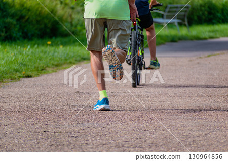 Man walking on a path, helathy activity to make exercice Man walking on a path, helathy activity to make exercice 130964856