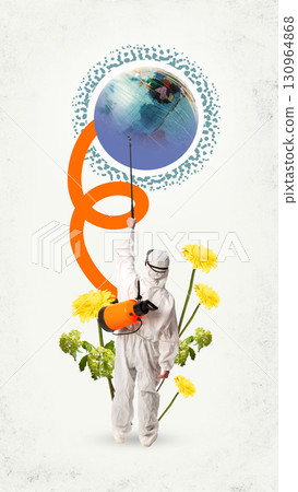 Person in white suit spraying globe with orange sprayer surrounded by yellow flowers 130964868