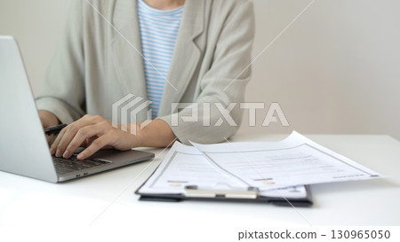 Business woman employer holding resume hiring recruit looking cv resume to hire candidates, analyzing information before job interview. Recruitment concepts 130965050