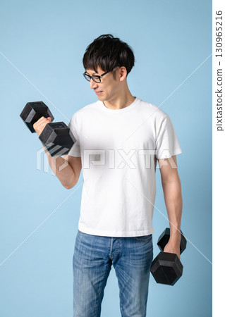 Men doing muscle training with dumbbells Men doing muscle training with dumbbells 130965216