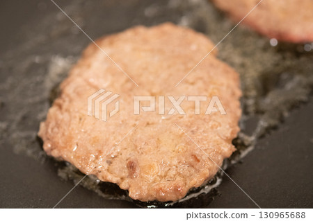 Hamburger patties being grilled on a hot plate (stock photo) Hamburger patties being grilled on a hot plate (stock photo) 130965688