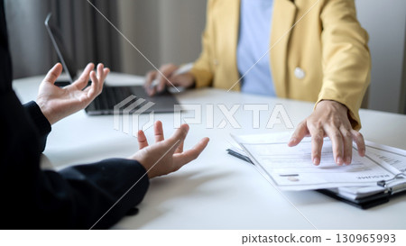 Business people hold a resume and talk to job applicants for job interviews about careers and Their personal history in the company. Recruitment concepts Business people hold a resume and talk to job applicants for job interviews about careers and Their personal history in the company. Recruitment concepts 130965993