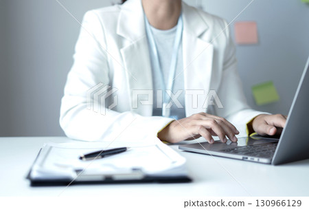 Business woman employer holding resume hiring recruit looking cv resume to hire candidates, analyzing information before job interview. Recruitment concepts 130966129