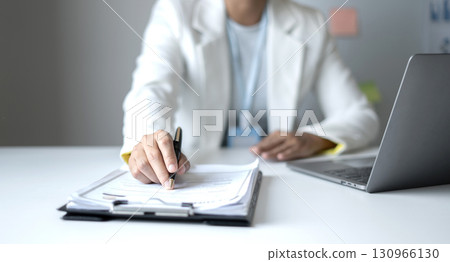 Business woman employer holding resume hiring recruit looking cv resume to hire candidates, analyzing information before job interview. Recruitment concepts 130966130