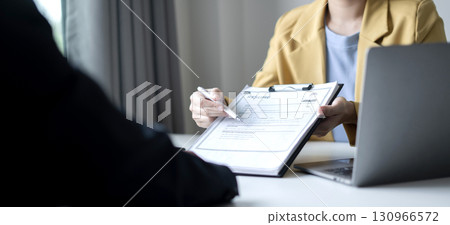 Business people hold a resume and talk to job applicants for job interviews about careers and Their personal history in the company. Recruitment concepts Business people hold a resume and talk to job applicants for job interviews about careers and Their personal history in the company. Recruitment concepts 130966572