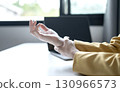 Woman hand with wrist pain numbness and pain in the palm of the hand has pain and tingling in the nerve endings This is a side effect of sitting and working for a long time on a laptop at the office 130966573