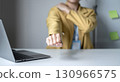 Woman having shoulder pain pain during work long time. stretching to relax and relax while working hard at the office 130966575