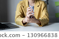Woman hand with wrist pain numbness and pain in the palm of the hand has pain and tingling in the nerve endings This is a side effect of sitting and working for a long time on a laptop at the office 130966838