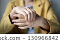 Woman hand with wrist pain numbness and pain in the palm of the hand has pain and tingling in the nerve endings This is a side effect of sitting and working for a long time on a laptop at the office 130966842