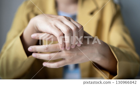 Woman hand with wrist pain numbness and pain in the palm of the hand has pain and tingling in the nerve endings This is a side effect of sitting and working for a long time on a laptop at the office 130966842