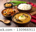 Traditional Nigerien fufu made from cassava and served beside a steaming peanut and okra soup. 130966911