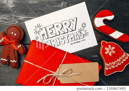 Festive gingerbread cookies and gift wrapping for Christmas and New Year celebration Festive gingerbread cookies and gift wrapping for Christmas and New Year celebration 130967495