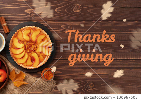 Celebrate Thanksgiving with a delicious apple pie and festive decorations in a cozy setting Celebrate Thanksgiving with a delicious apple pie and festive decorations in a cozy setting 130967505