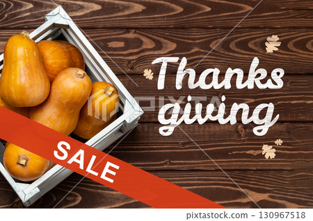Thanksgiving sale featuring seasonal squash in a wooden crate on a rustic table Thanksgiving sale featuring seasonal squash in a wooden crate on a rustic table 130967518