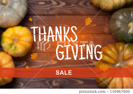 Thanksgiving sale with colorful pumpkins on wooden background during autumn season 130967600