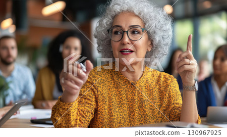 Middle-aged white woman leading focus group discussion in a modern coworking lounge. Survey research answer checklist 130967925
