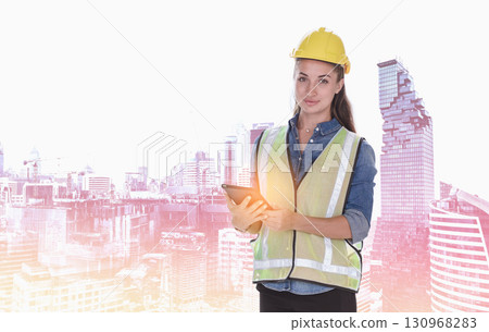 Double exposure image of female construction engineer in yellow safety helmet and holding tablet computer standing during overlay with construction site in the city. Double exposure image of female construction engineer in yellow safety helmet and holding tablet computer standing during overlay with construction site in the city. 130968283