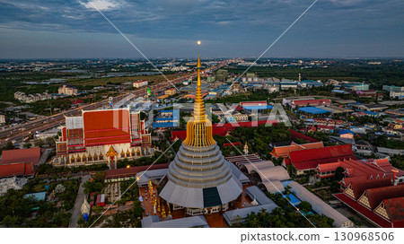 Aerial view of The moon is situated on top of the golden umbrella of the pagoda. Aerial view of The moon is situated on top of the golden umbrella of the pagoda. 130968506