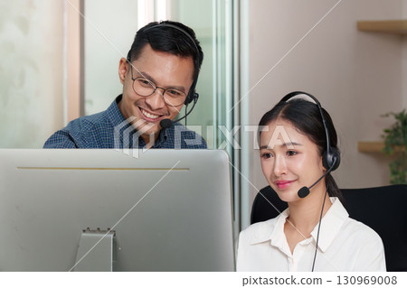 Call Center Agents Engaging in Customer Service Training Call Center Agents Engaging in Customer Service Training 130969008