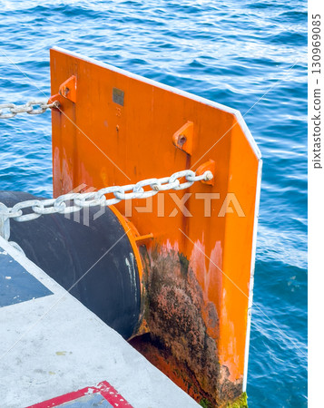 Protective board and mooring rope at the pier by the sea 130969085