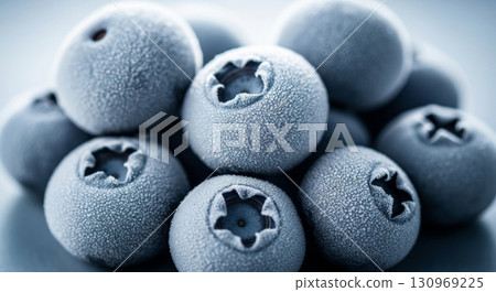 Frozen Blueberries with Frost in Stack Close Up 130969225