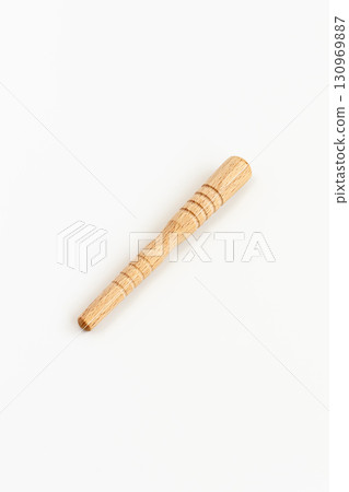 Acupressure stick on white background 130969887