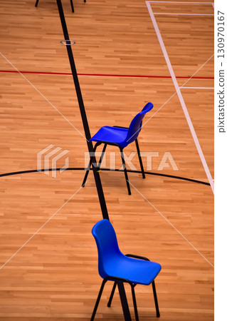 Chair in the badminton court. No people in the badminton court, sports center. Sports and recreation concept. 130970167