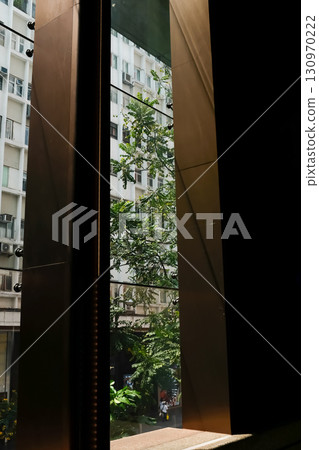 Looking from window with beautiful scene, city scene. Building structure.  130970222