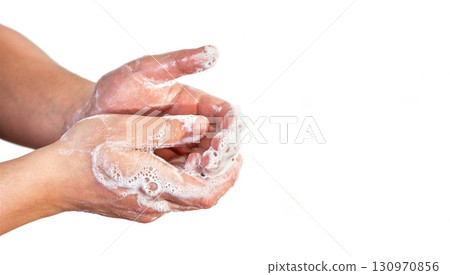 Young man wash hands with soap, closeup detail on soap bubbles, isolated on white, space for text right side. Can be used during coronavirus covid-19 outbreak prevention 130970856