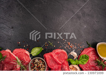 Raw organic steak with ingredients for cooking Raw organic steak with ingredients for cooking 130971099
