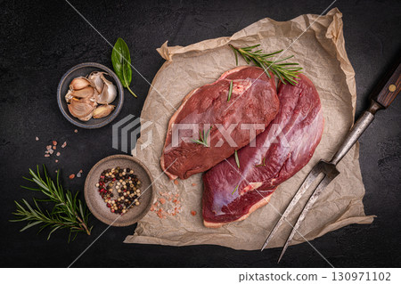 Preparation for cooking raw duck breast 130971102