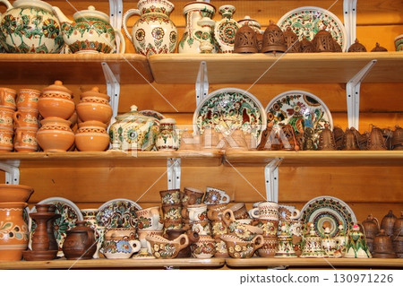 Earthenware on the shelves of shop. Ceramic goods. Products of ceramics on sale Earthenware on the shelves of shop. Ceramic goods. Products of ceramics on sale 130971226
