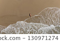 Pregnant Woman Relaxing by the Ocean Aerial Beach Photography 130971274