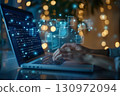 A modern workspace with a person's hands typing on a laptop keyboard, futuristic translucent document icons floating above the screen. 130972094