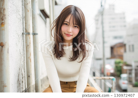 A woman in a sweater A woman in a sweater 130972407