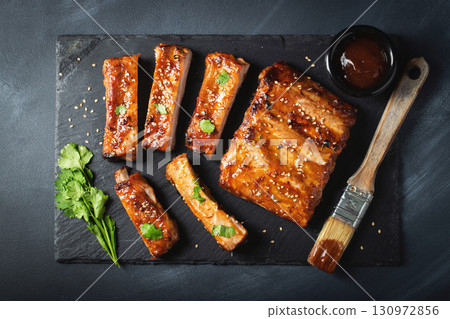 Barbecue pork spare ribs with hot honey chili marinade on black background 130972856