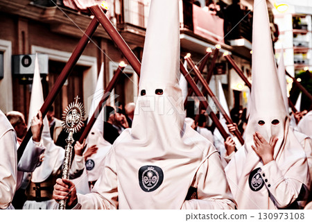 Nazarene-penitent, during the Holy Week procession in Alcala de Guadaira, Andalusia, Seville.	 130973108